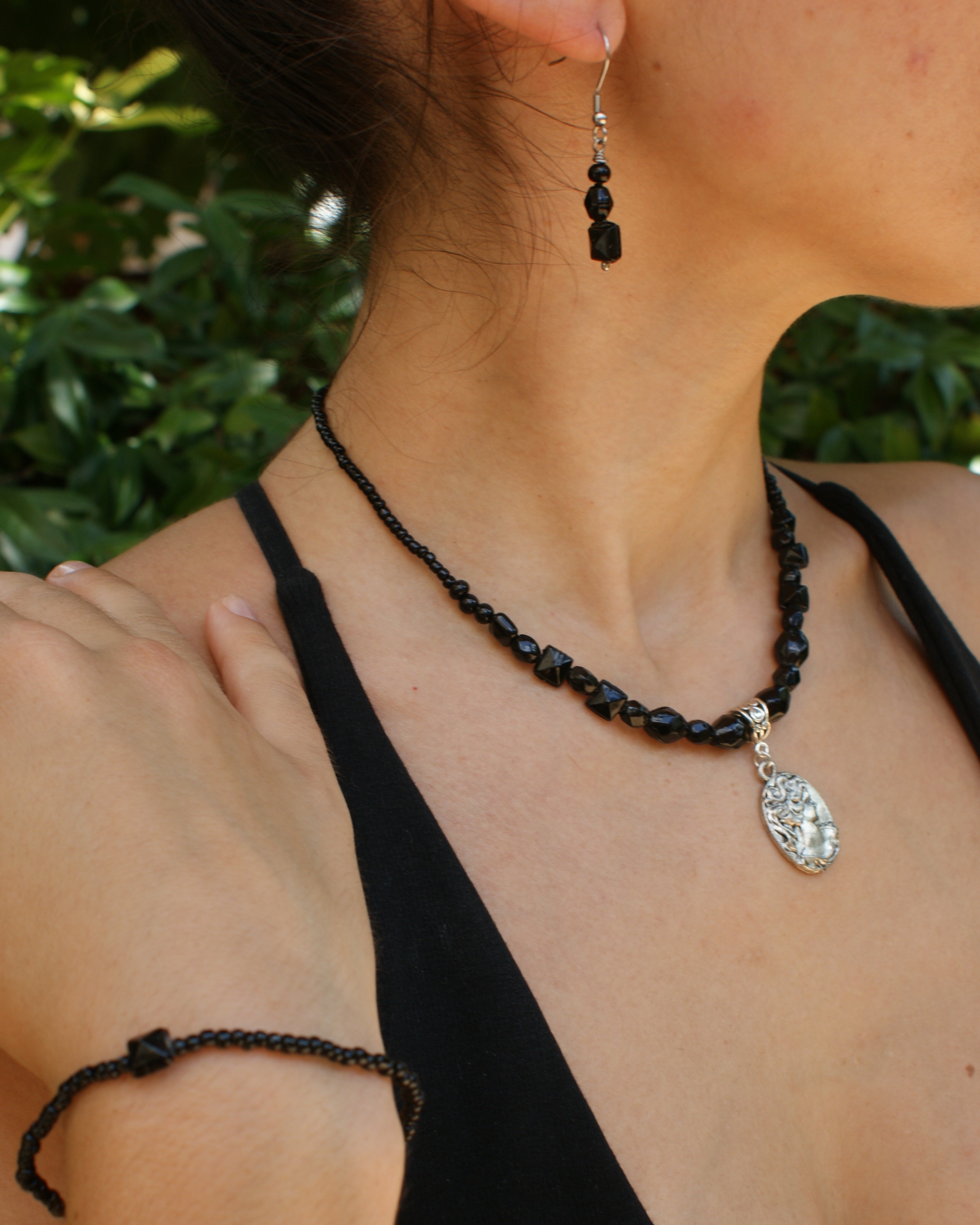 Black upcycled set with medallion - necklace, bracelet, and earrings (alternate view)
