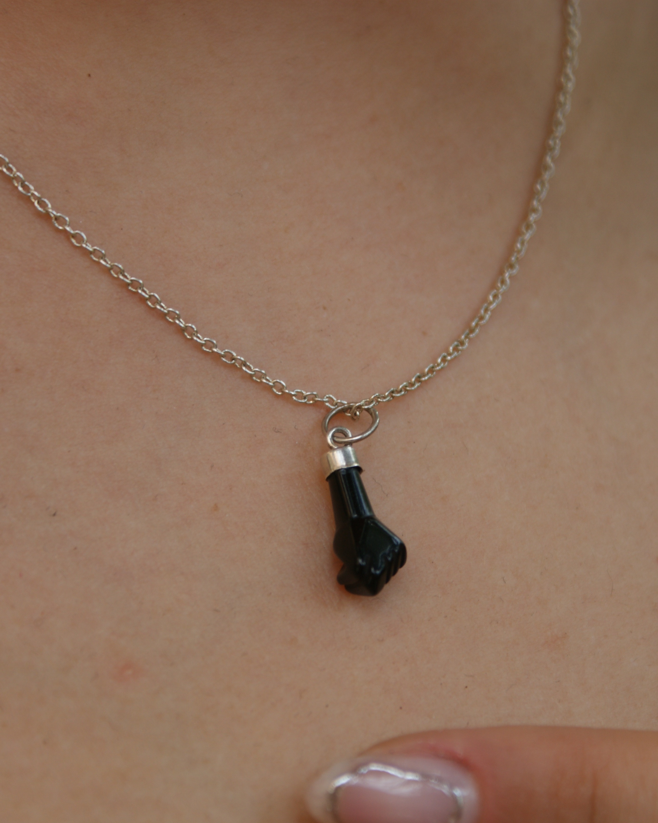 Silver necklace with figa hand pendant (alternate view)