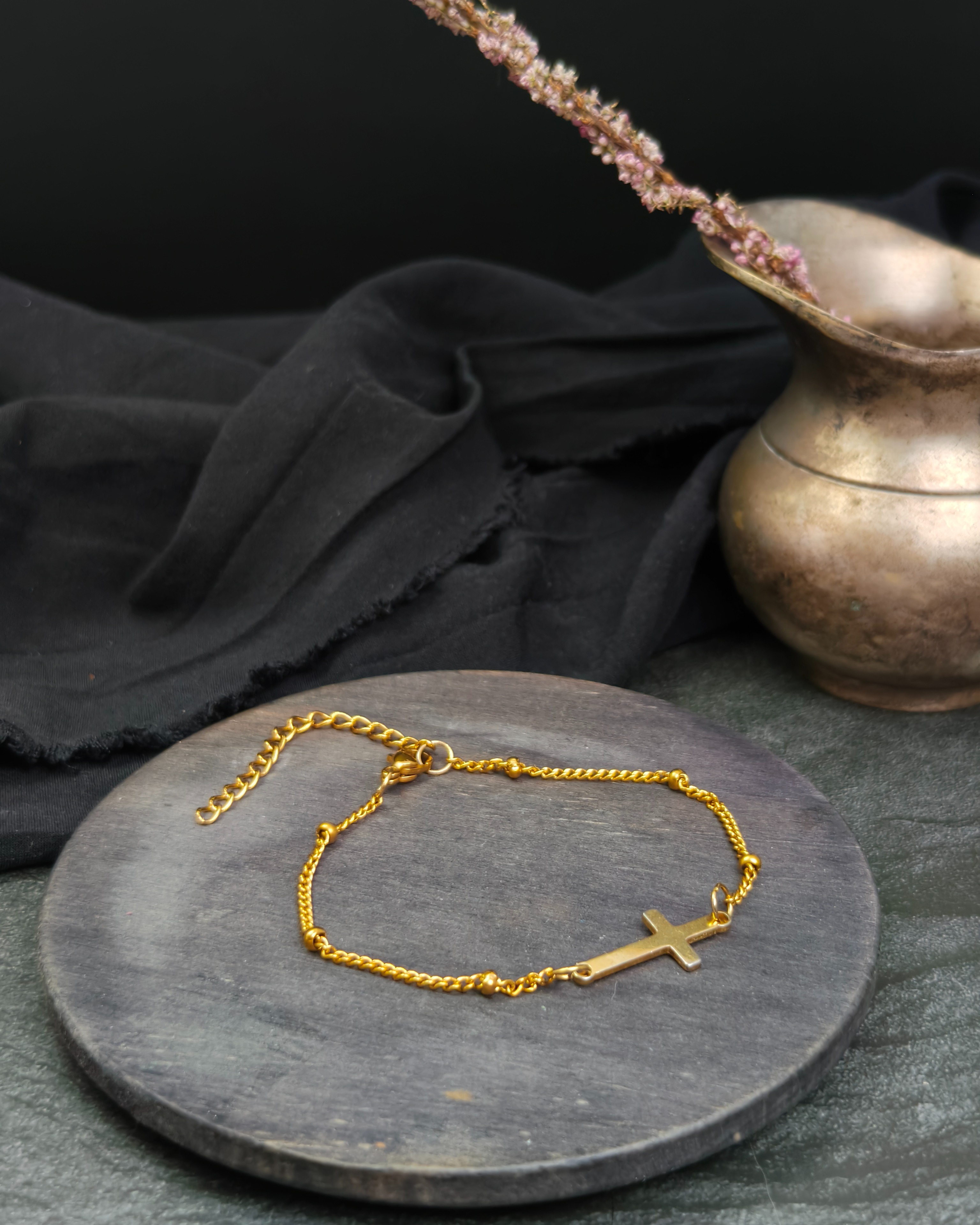 Delicate bracelet with a stainless steel cross