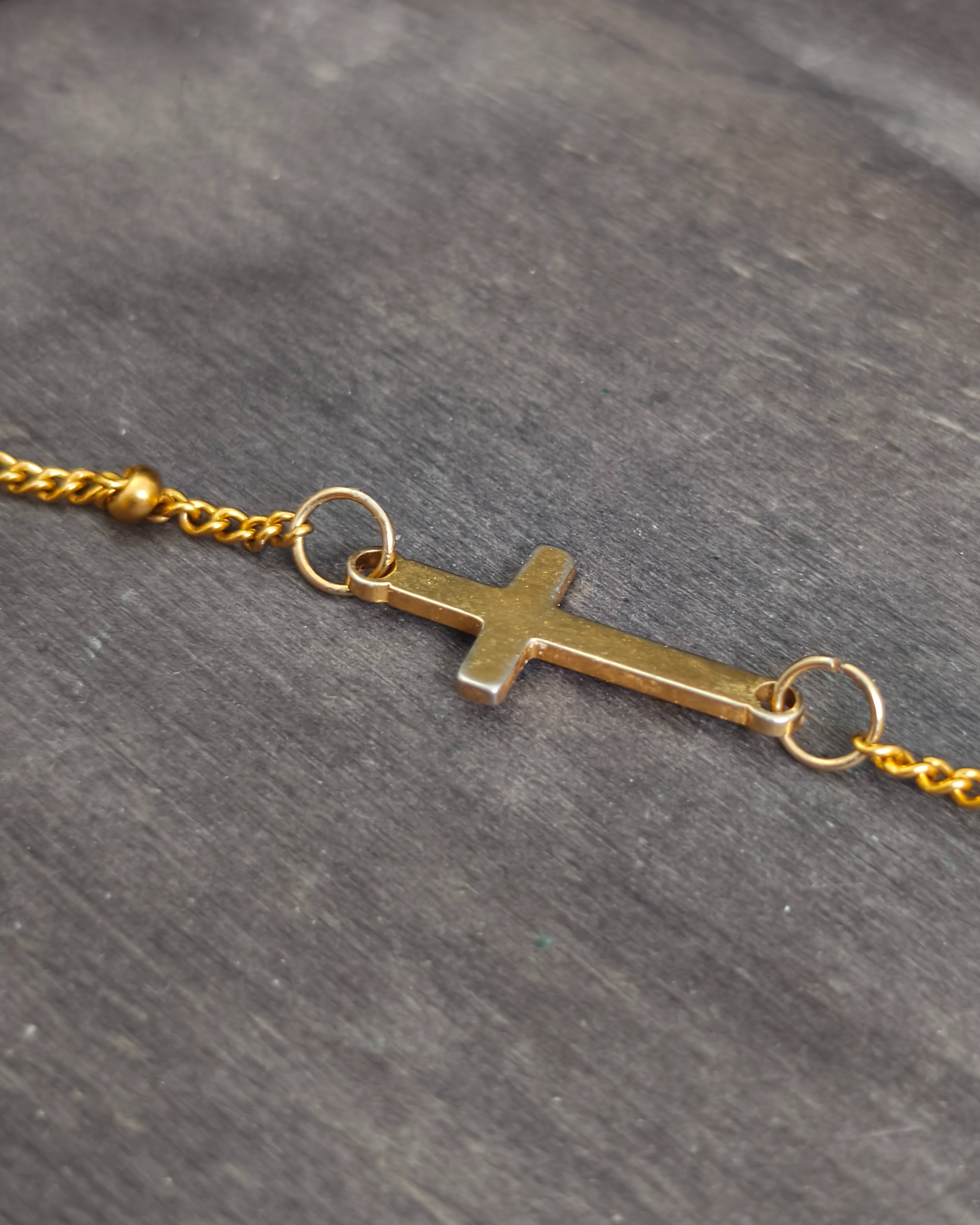 Delicate bracelet with a stainless steel cross (alternate view)