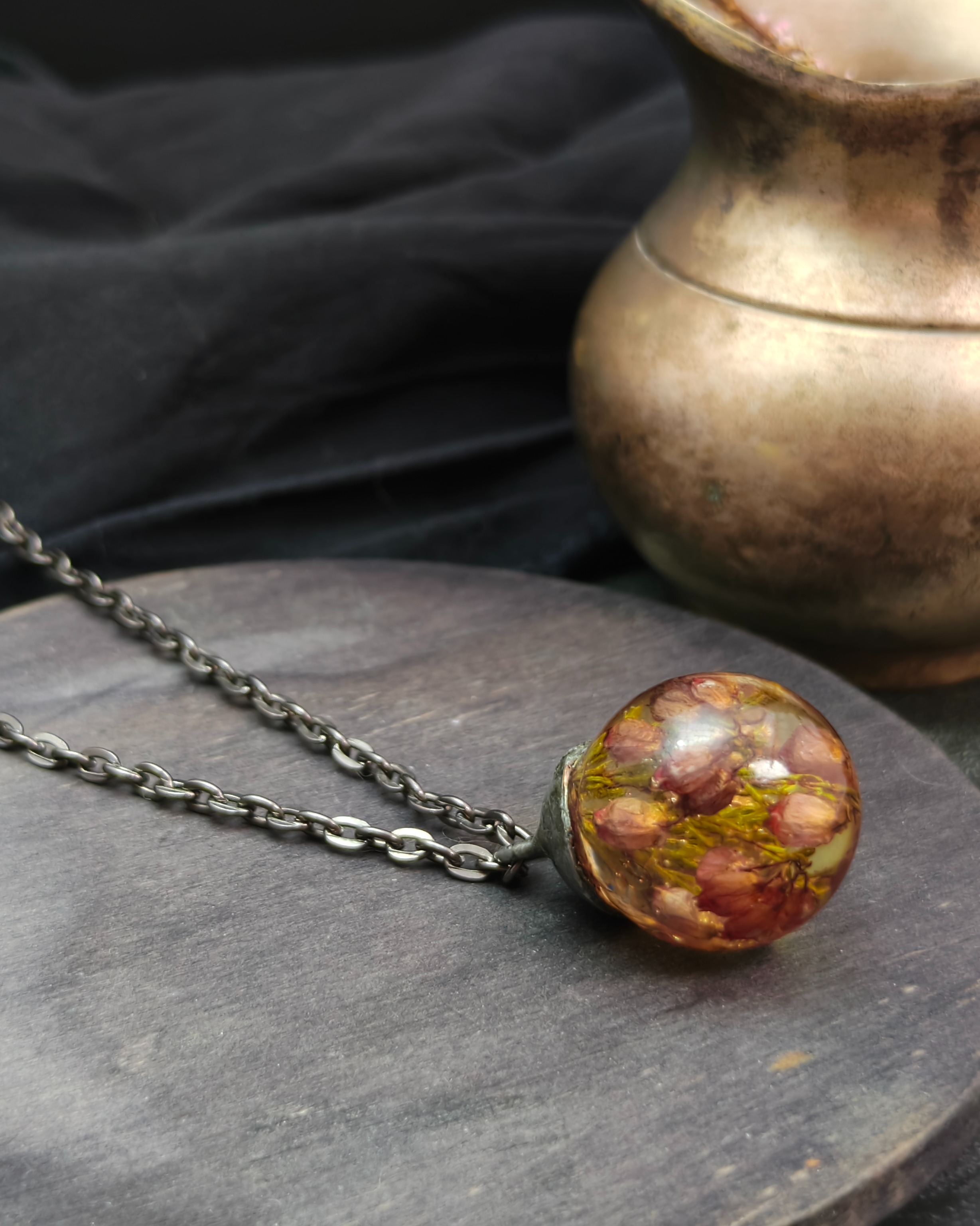 Pink heather necklace in a resin sphere (alternate view)
