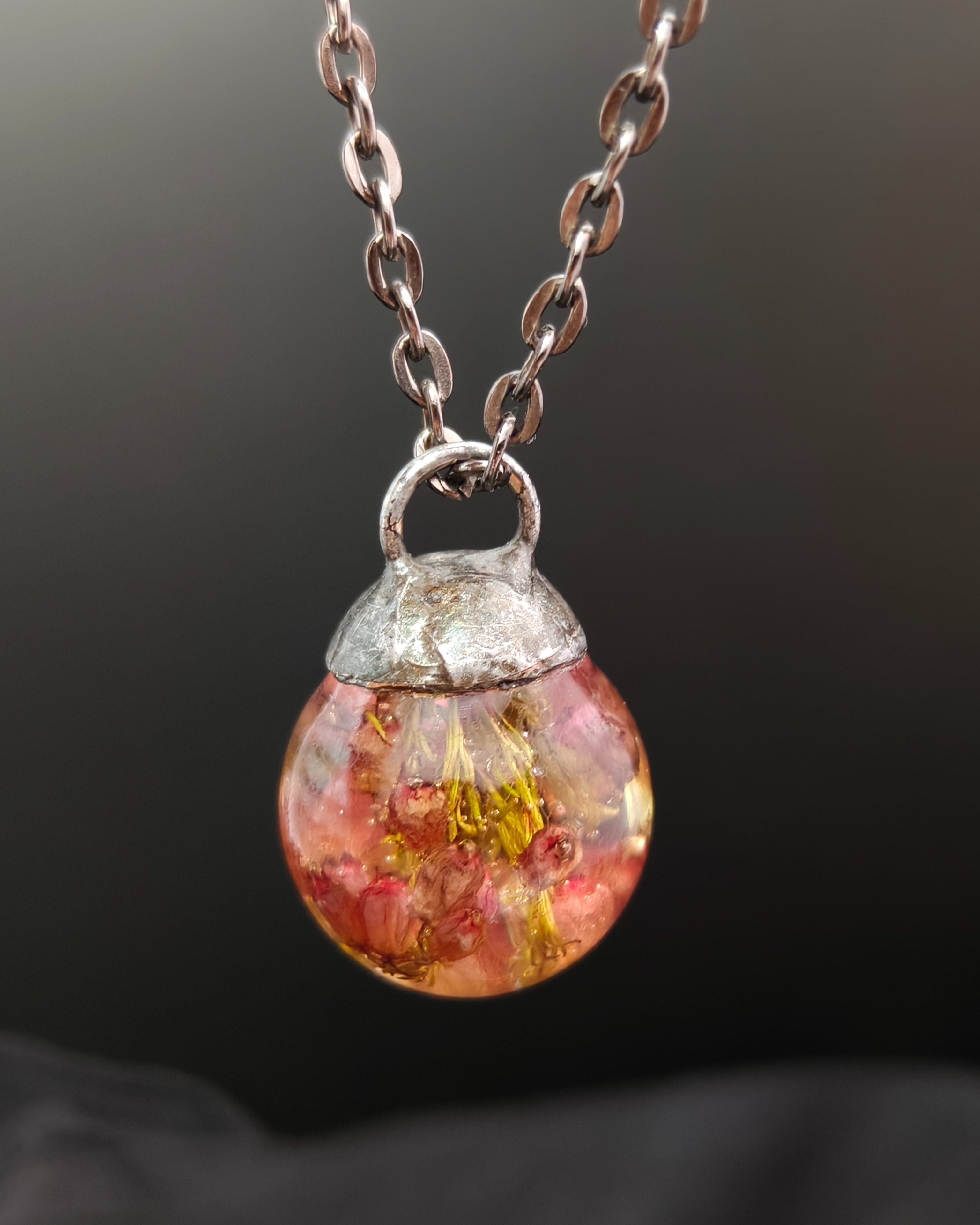Pink heather necklace in a resin sphere