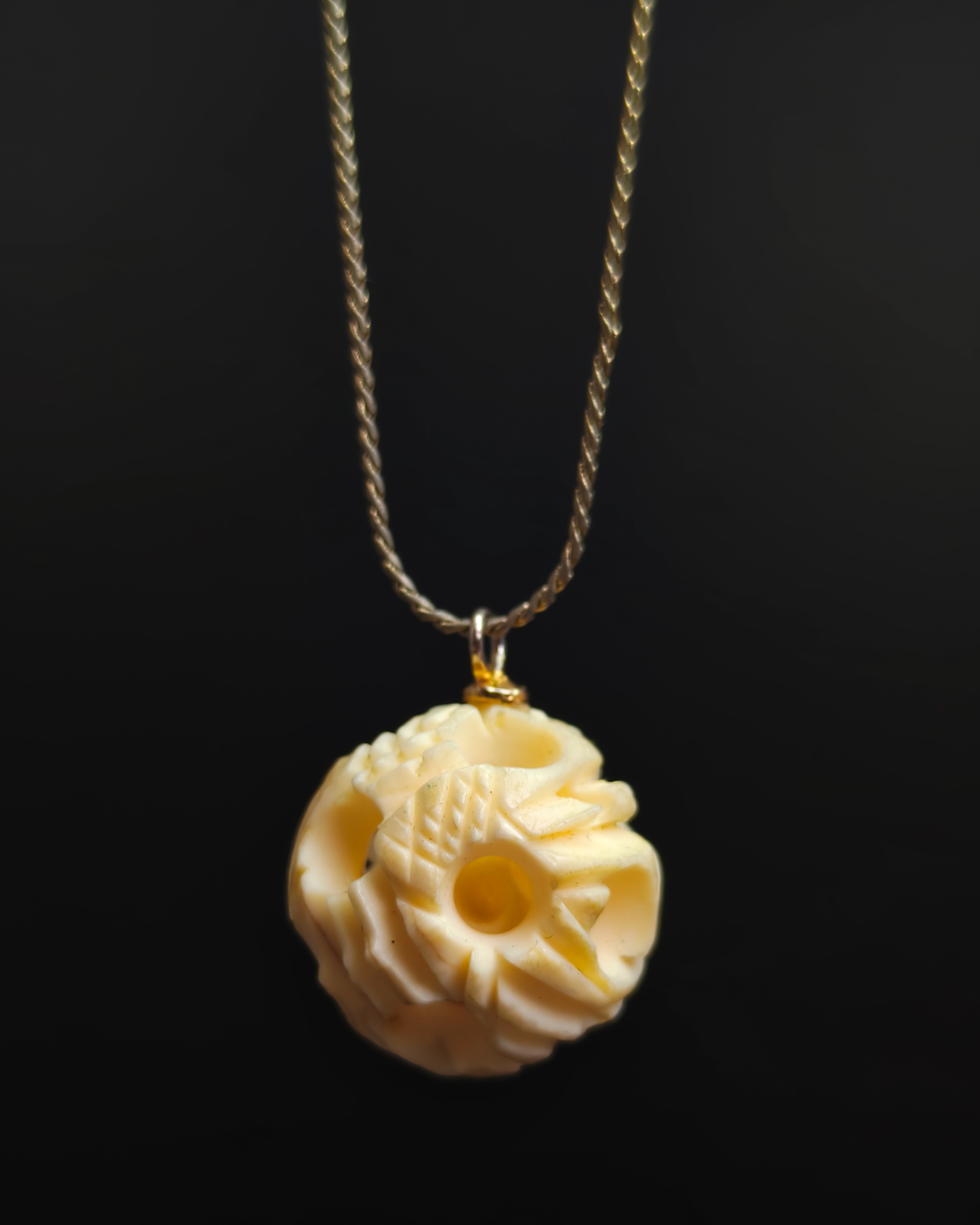 Necklace with double concentric bone sphere