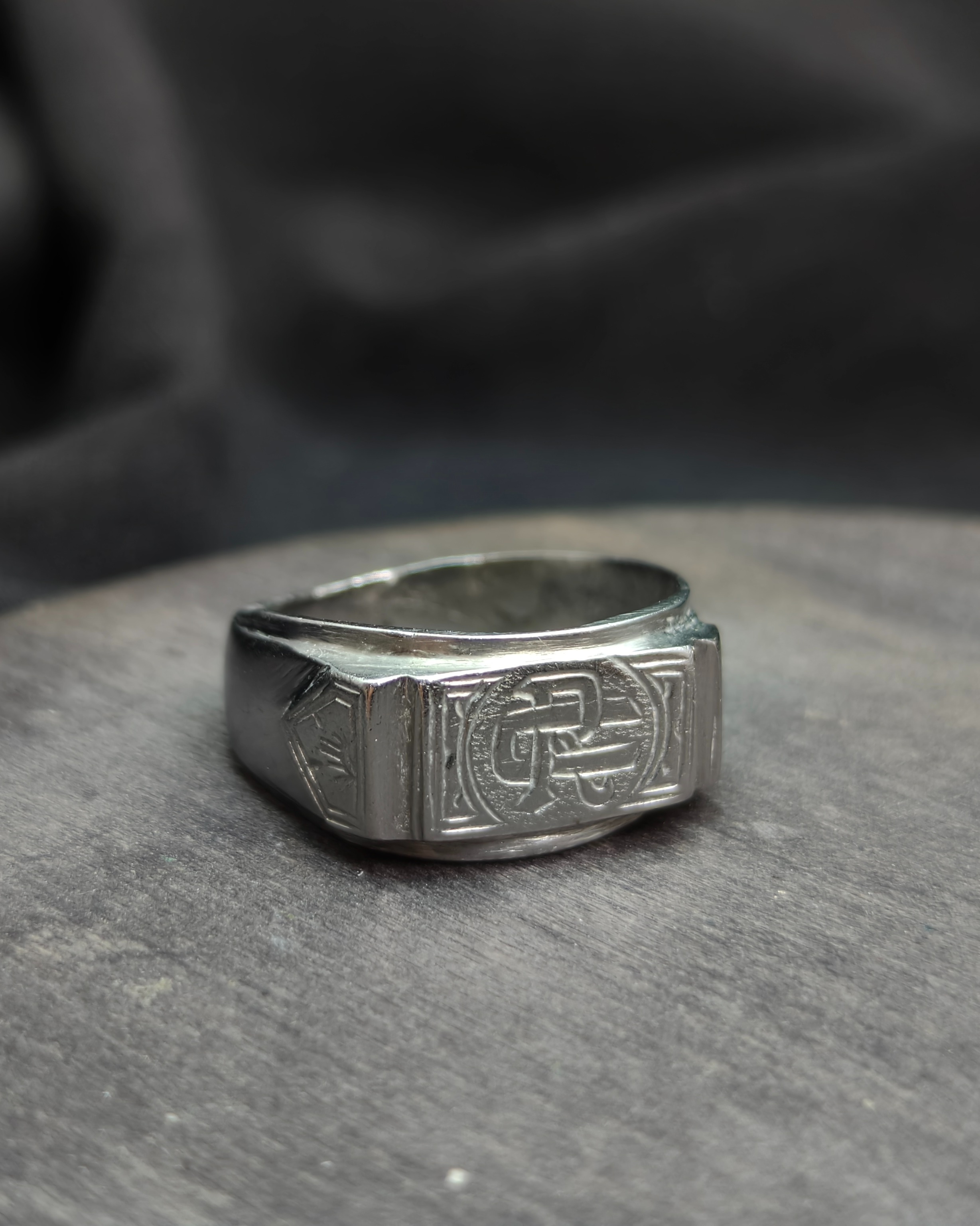 Stamp with initials "R" and "U"