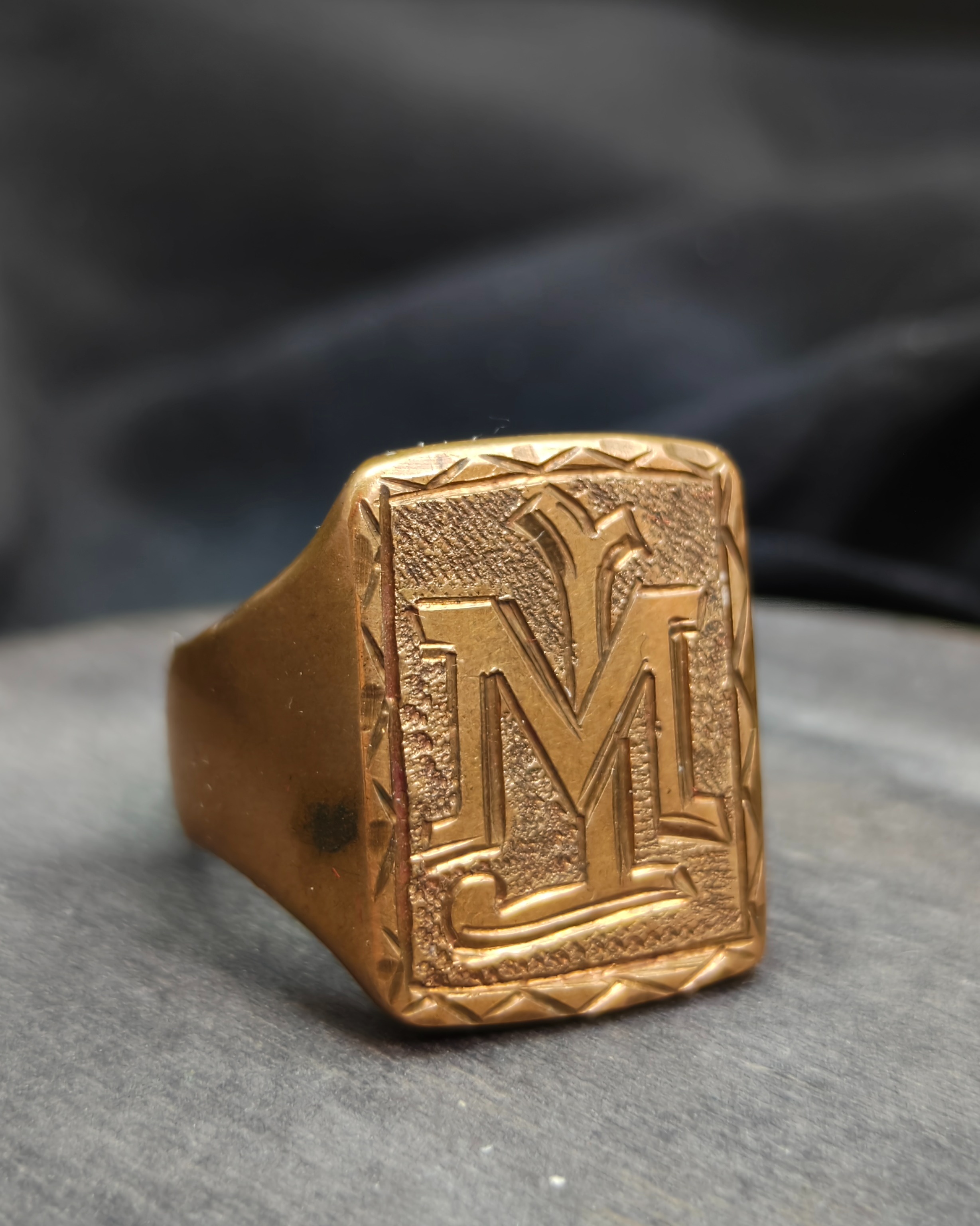 Seal ring with initials "M" and "J"