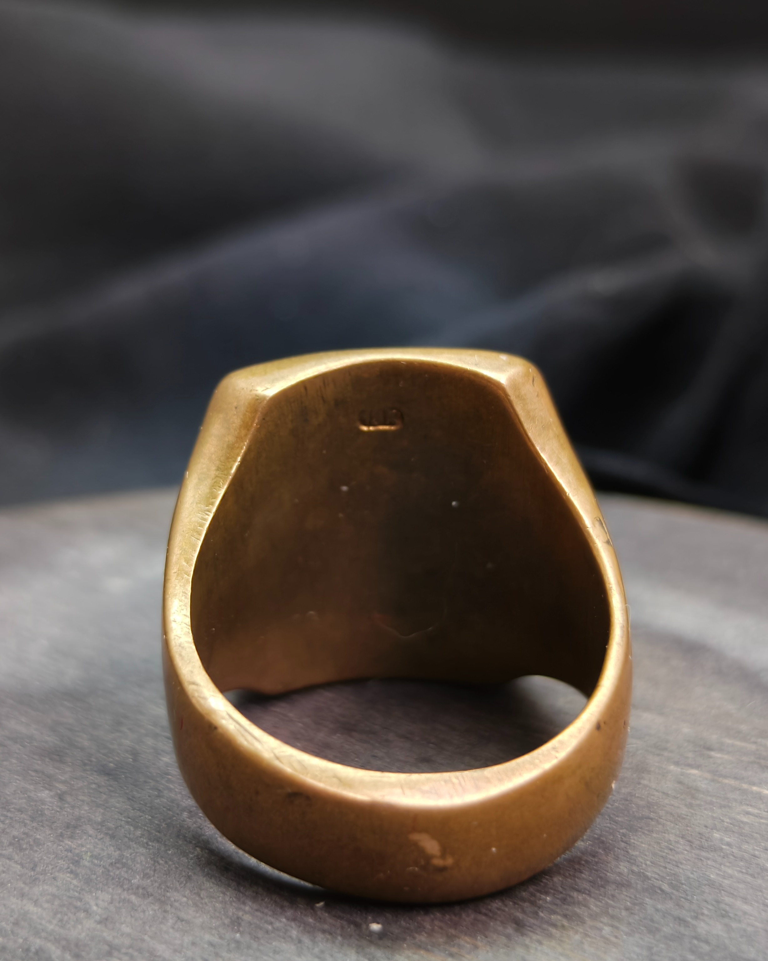 Seal ring with initials "M" and "J" (alternate view)