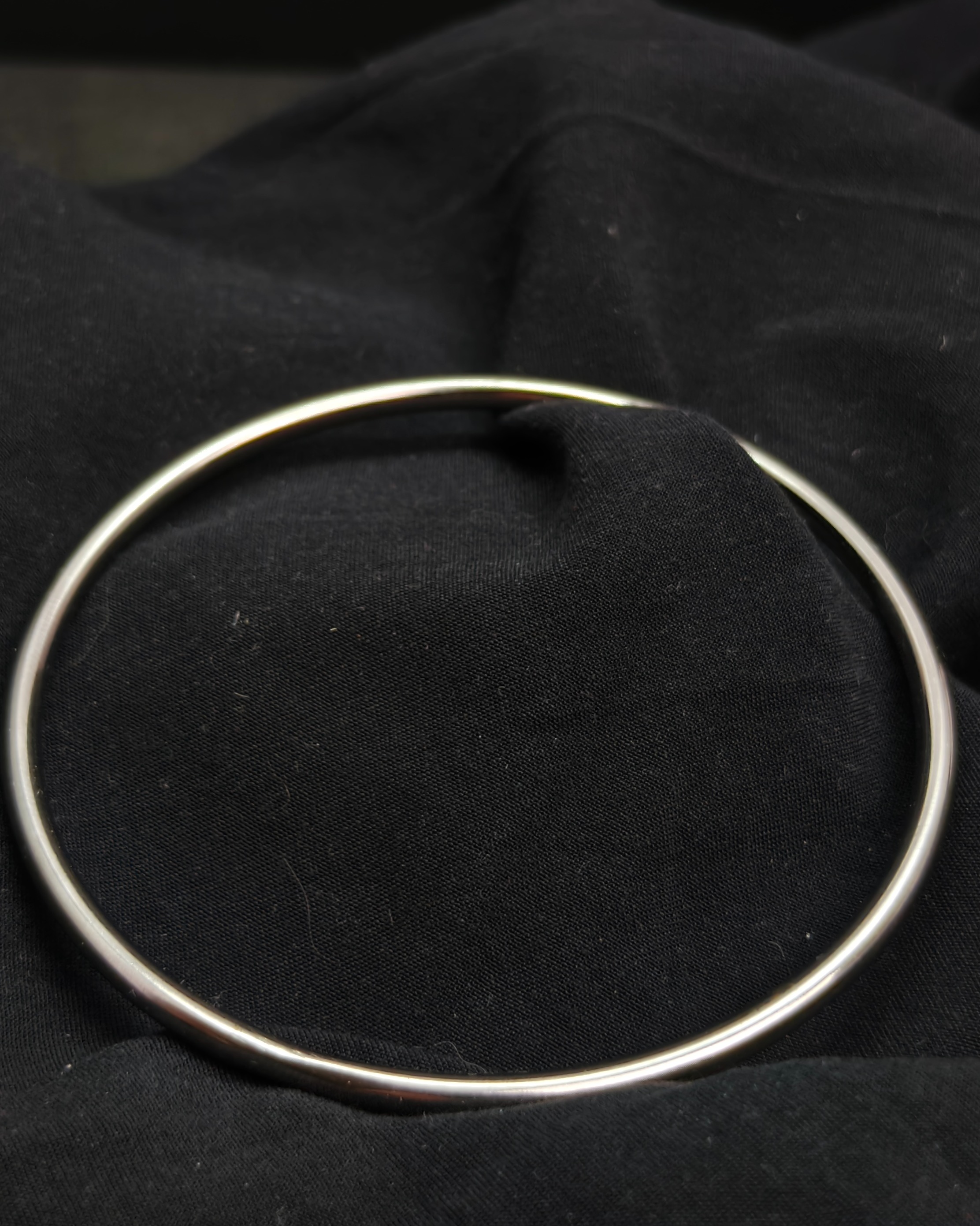 Silver tone slave bracelet