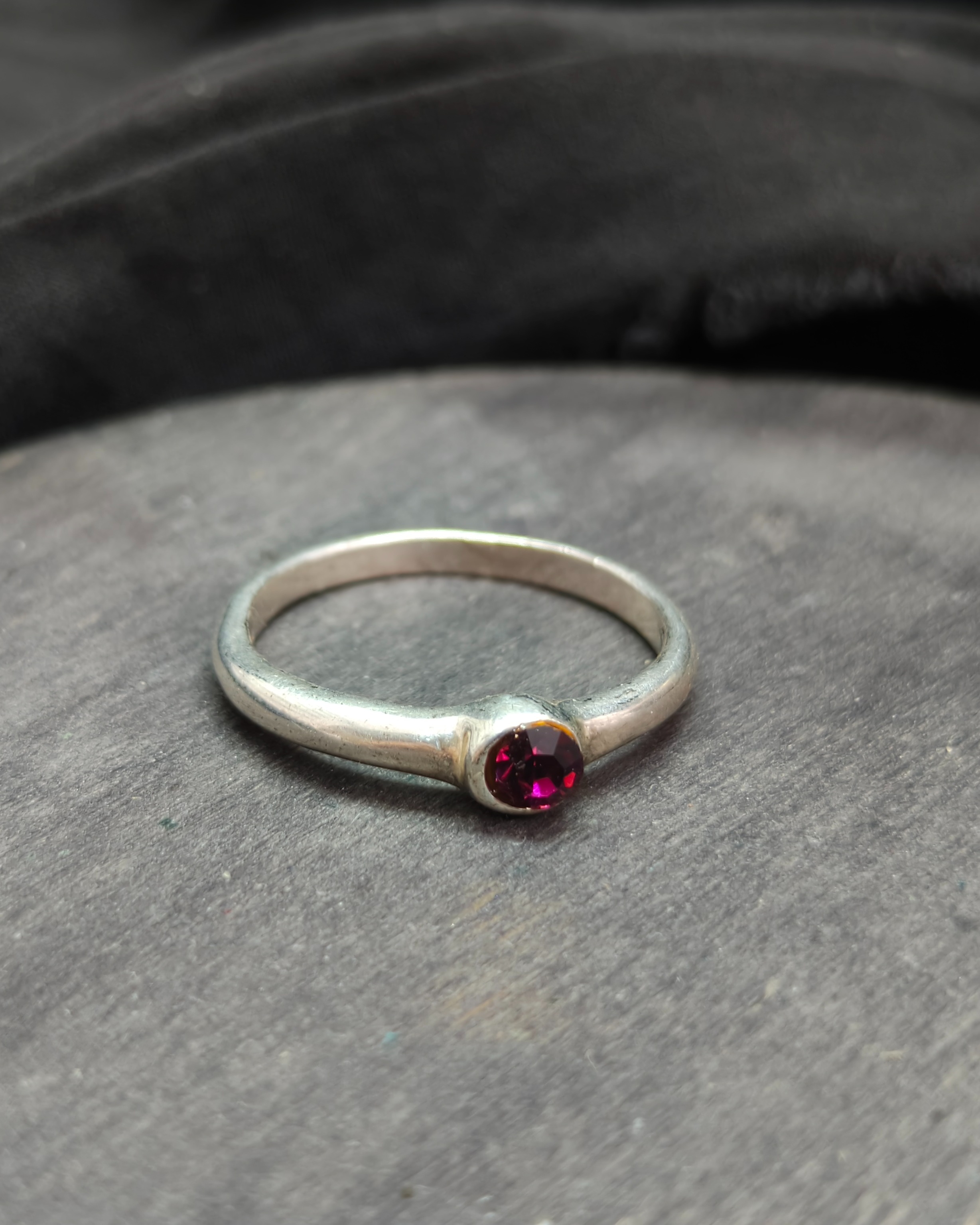Silver plated ring with purple diamond