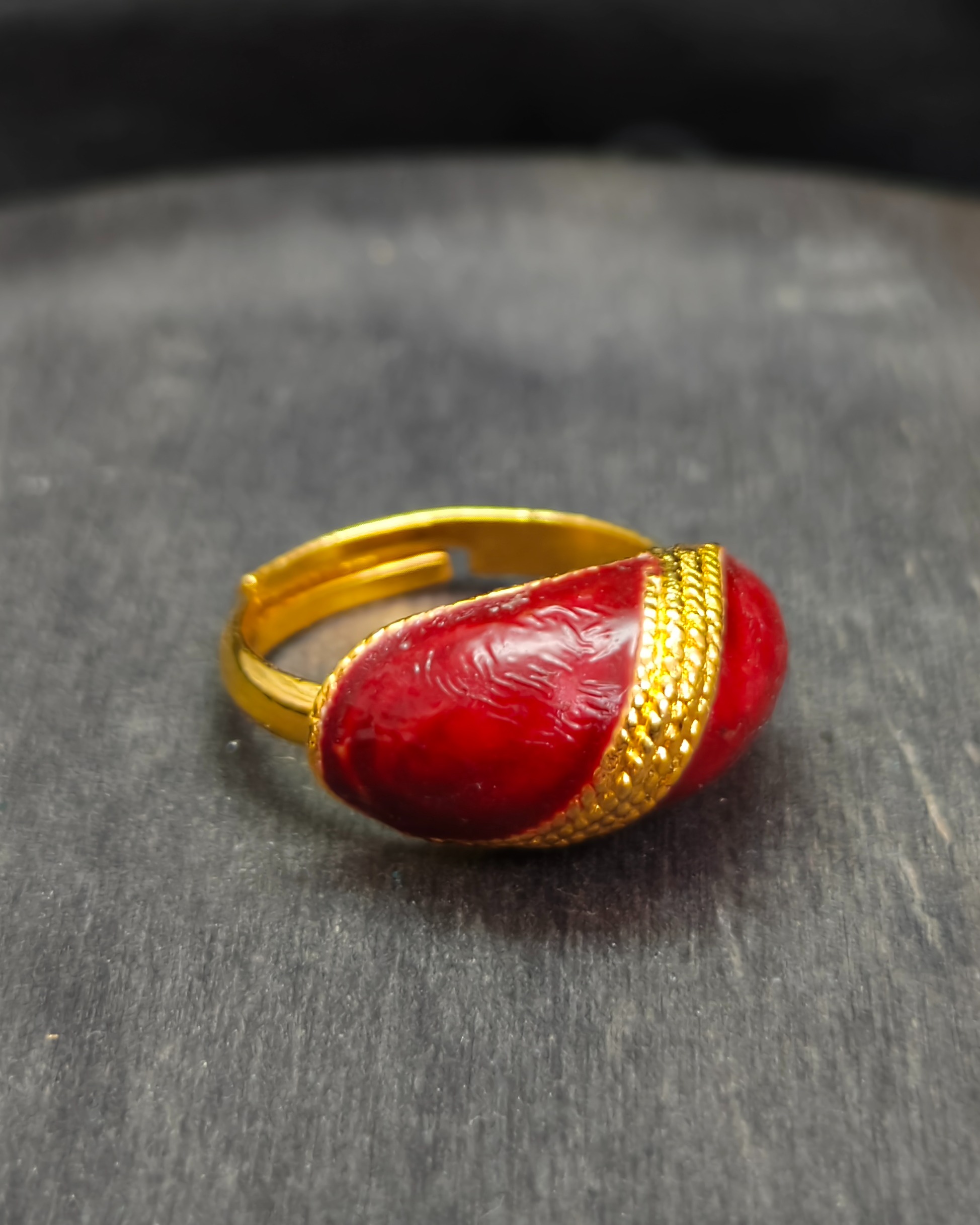 Gold-tone adjustable ring with red resin