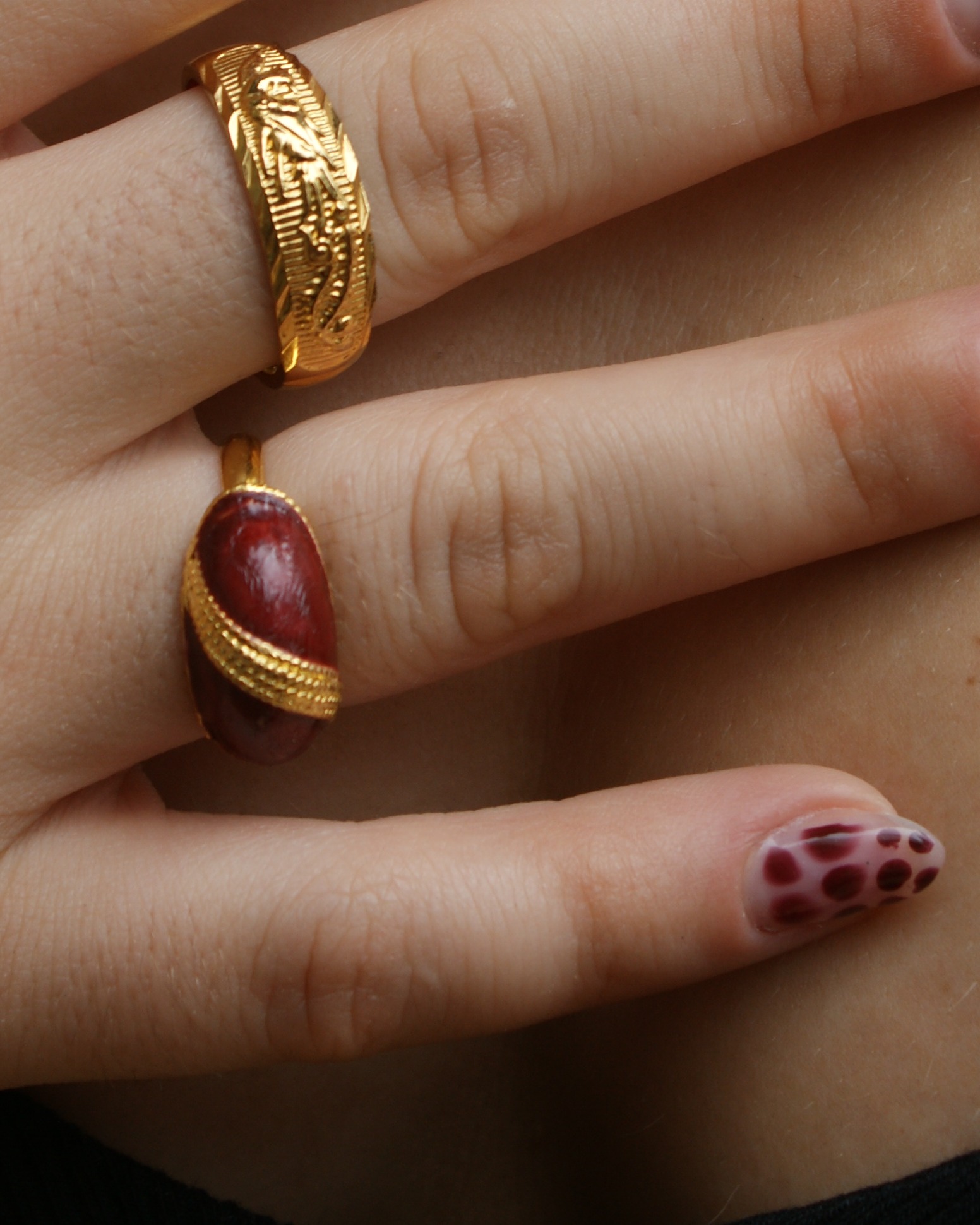 Gold-tone adjustable ring with red resin (alternate view)