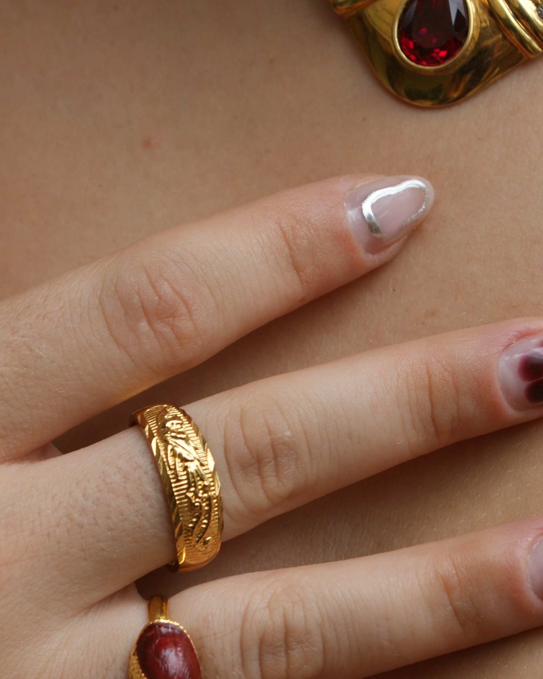 Adjustable golden-tone ring with a Phoenix in relief (alternate view)