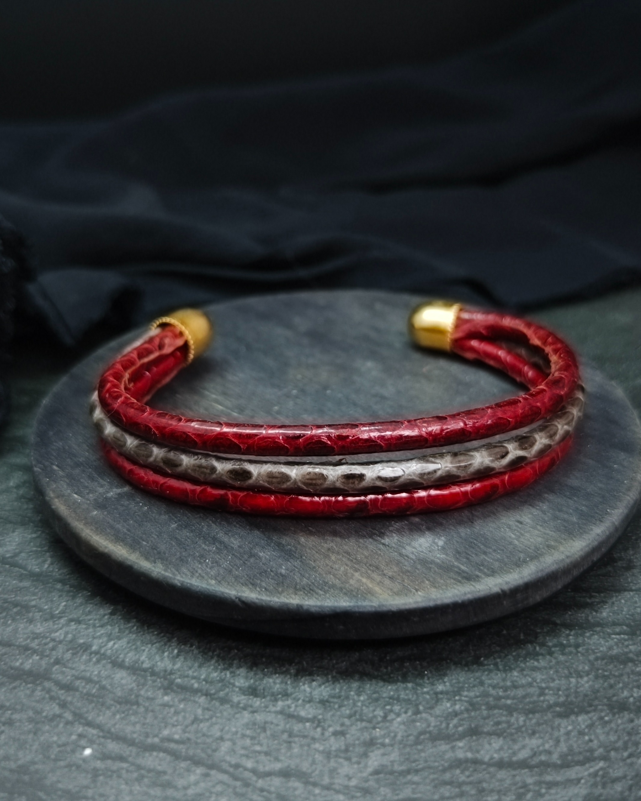 Red bracelet with snakeskin effect